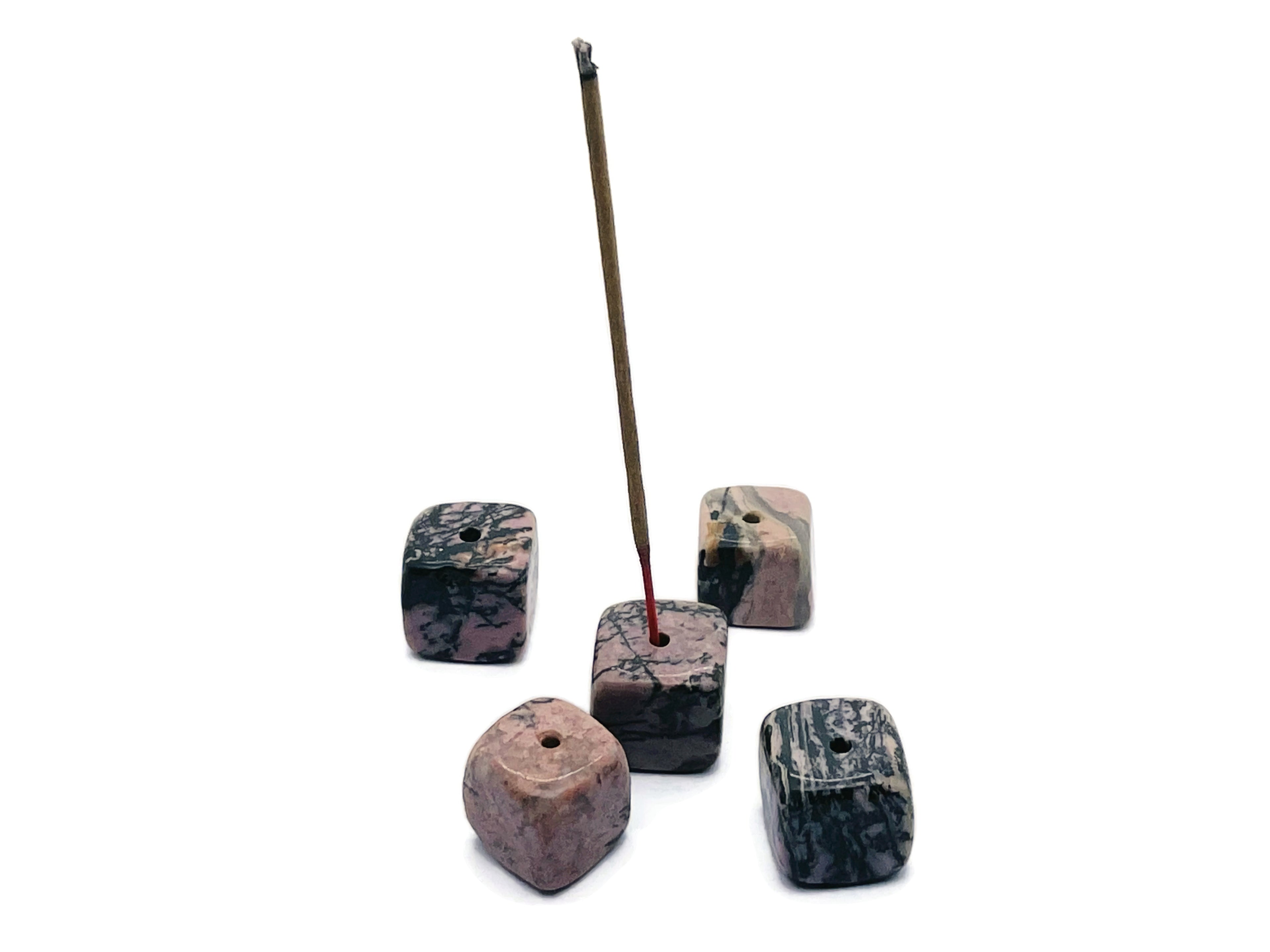 Handmade Rhodonite crystal incense holder with carved design, featuring a stone slot for incense sticks, by GemstoneGO.
