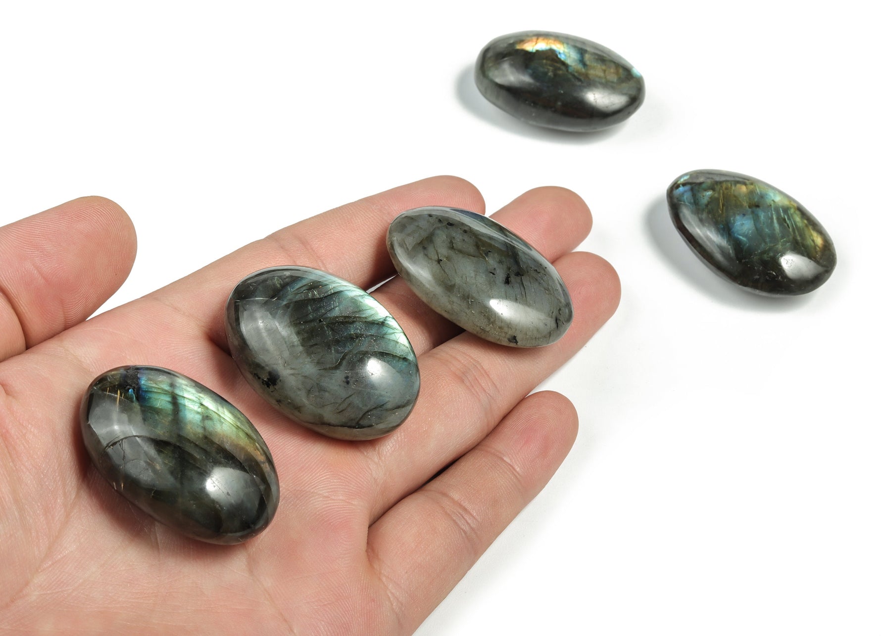Labradorite palm gemstone spa stone from GemstoneGO, smooth polished healing stone with iridescent flash, perfect for relaxation and meditation.