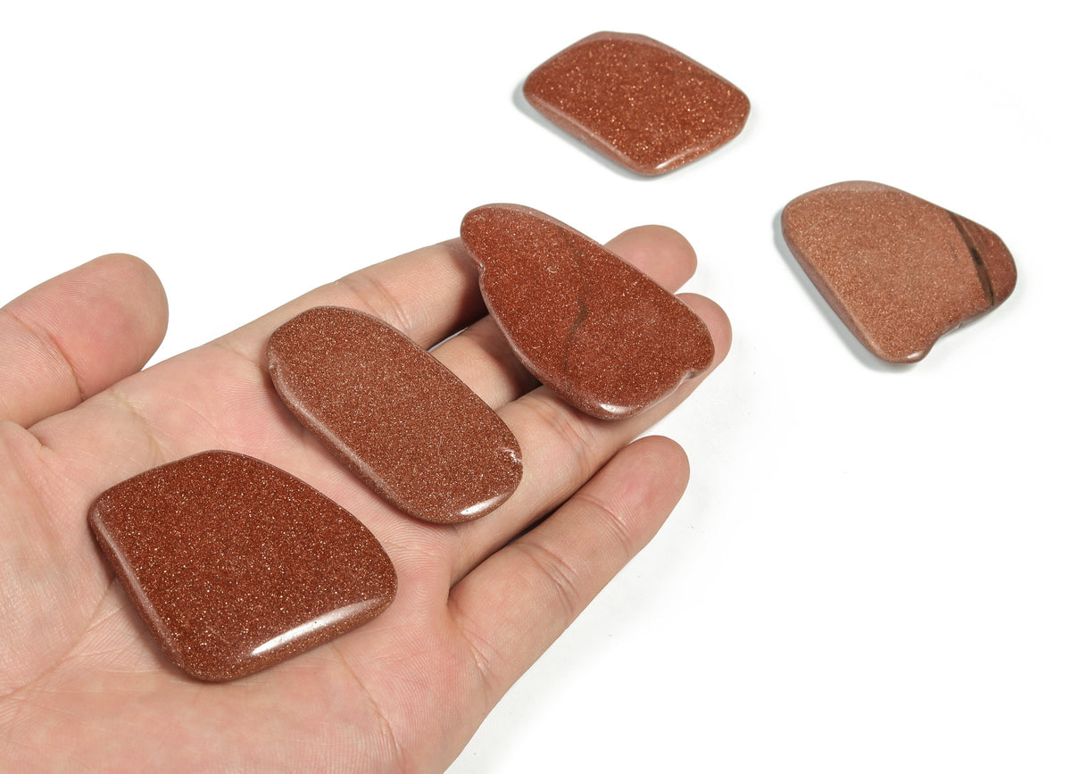 Goldstone flat gemstone slab from GemstoneGO, showcasing a shimmering, smooth crystal crystal with rich golden hues.