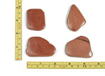 Goldstone flat gemstone slab from GemstoneGO showing a smooth, polished gold-colored crystal surface with natural patterns.