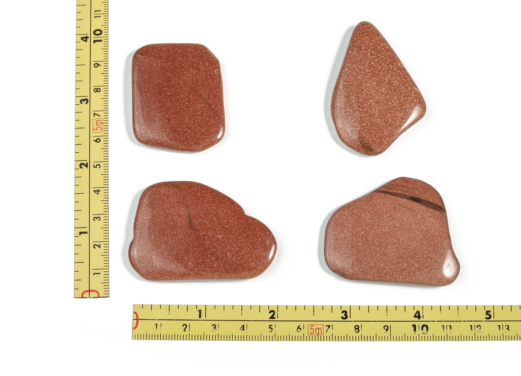 Goldstone flat gemstone slab from GemstoneGO showing a smooth, polished gold-colored crystal surface with natural patterns.
