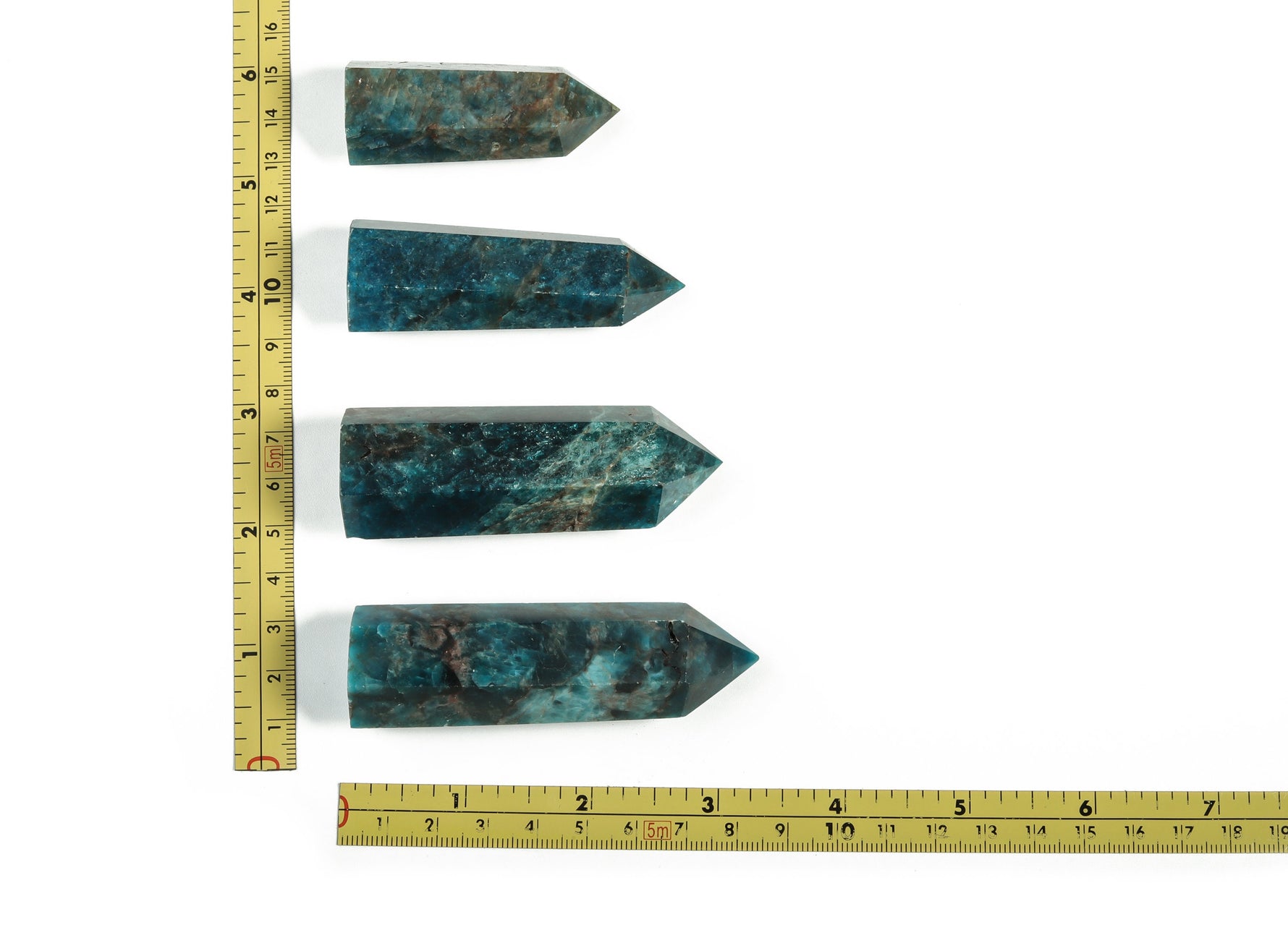 Blue Apatite Quartz obelisk tower crystal from GemstoneGO, showcasing a polished blue mineral with natural crystal details.
