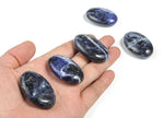 Sodalite palm gemstone spa stone from GemstoneGO, 45x35mm, featuring deep blue and white mineral patterns for relaxation and meditation.