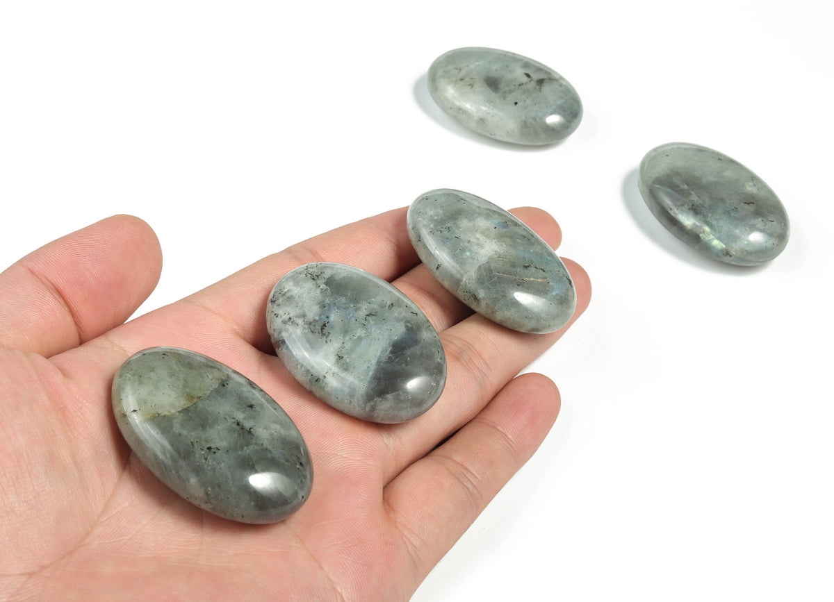 Labradorite palm gemstone spa stone, 45x35mm, polished natural mineral with iridescent flashes, used for healing and relaxation.