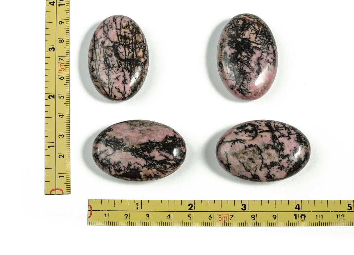 Rhodonite palm gemstone spa stone, 45x35mm, smooth polished healing gemstone for massage and relaxation.