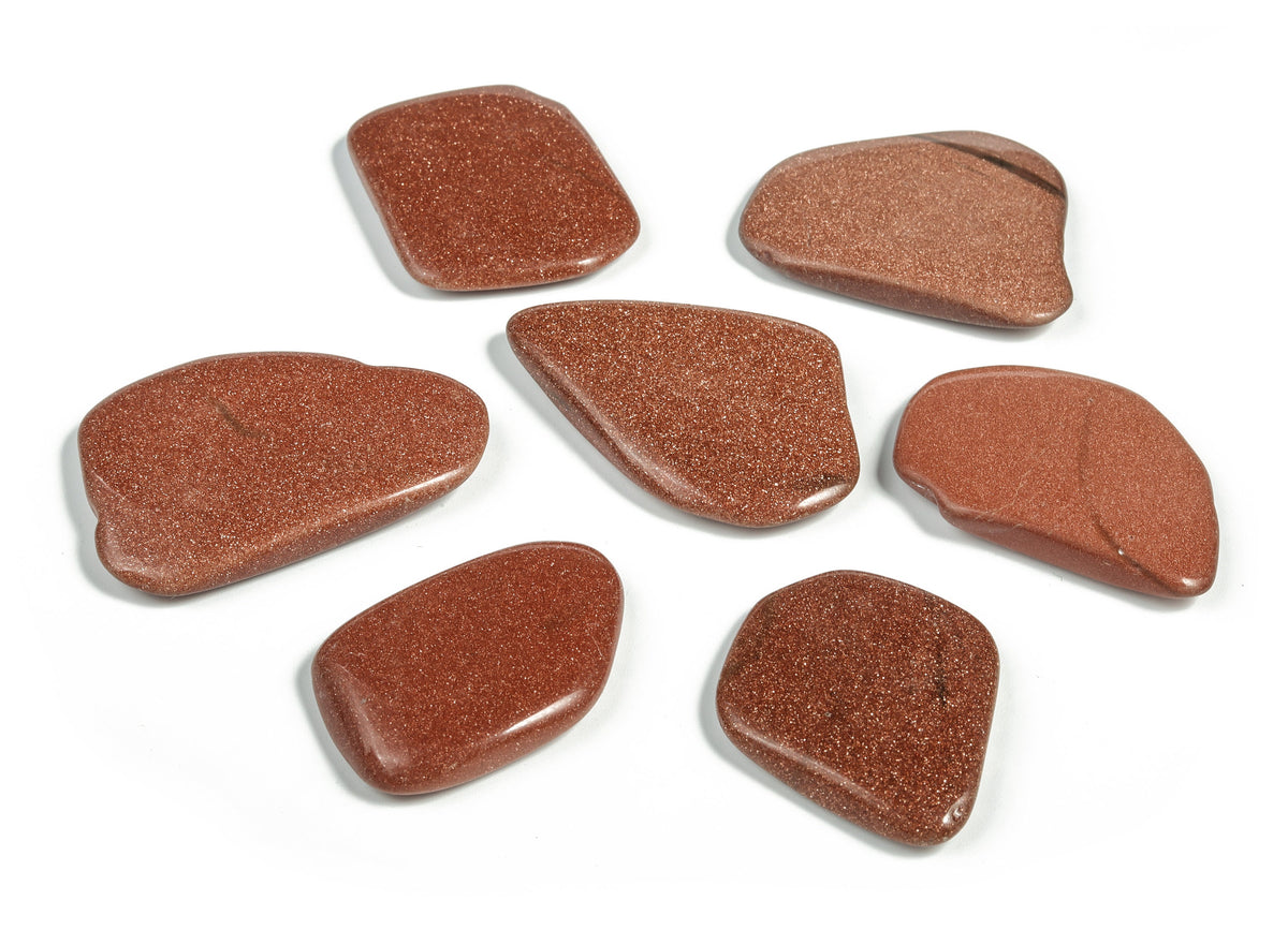 Goldstone flat gemstone slab from GemstoneGO, showcasing a smooth, polished crystal surface with a rich, sparkling golden hue.
