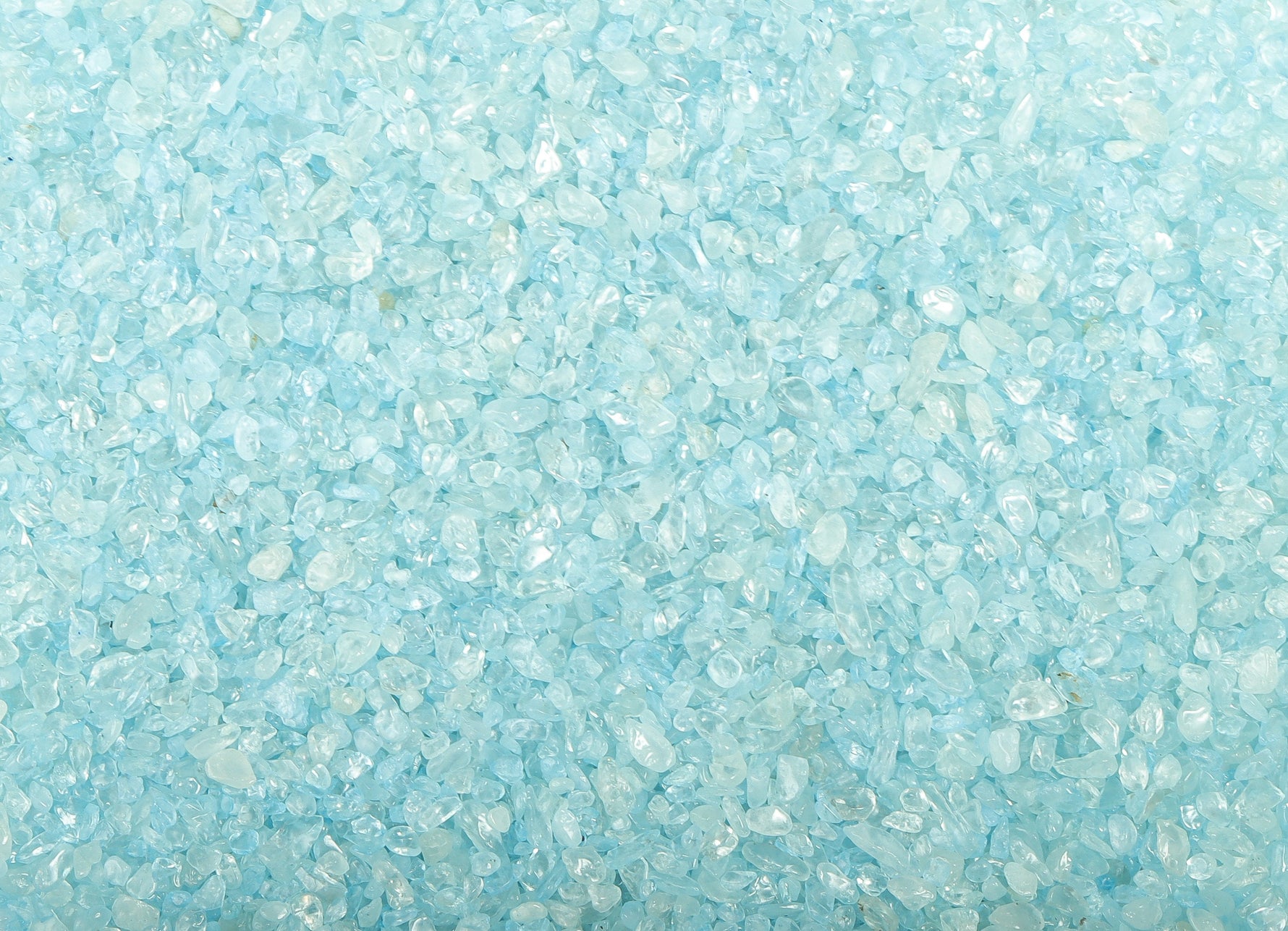 Semi-tumbled aquamarine crystal chips in 2-6mm size, natural gemstone bulk stones from GemstoneGO.