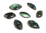 Labradorite leaf-shaped gemstone with hole for jewelry making by GemstoneGO, showcasing iridescent blue and green hues.