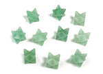 A 13mm aventurine Merkaba star crystal for Reiki healing, displayed on a white background, showcasing its green gemstone facets.