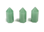 A 35mm green aventurine obelisk tower crystal from GemstoneGO, polished stone with natural stone patterns and smooth surfaces.