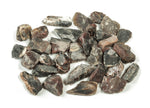 Raw petrified wood gemstone from GemstoneGO, showing natural textured patterns and earthy brown tones.