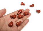 Red Jasper mushroom carved gemstone, 20mm, showing detailed mushroom shape with rich red color and natural stone texture.