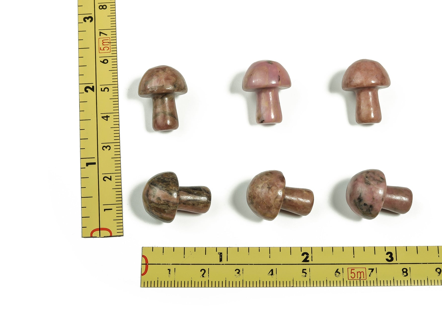20mm Rhodonite mushroom carved gemstone from GemstoneGO, showcasing a smooth, polished pink and black stone with natural patterns.