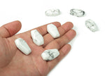 Howlite coffin-shaped crystal cabochon, 30mm gemstone carving by GemstoneGO showcasing smooth polished surface and natural white veining.