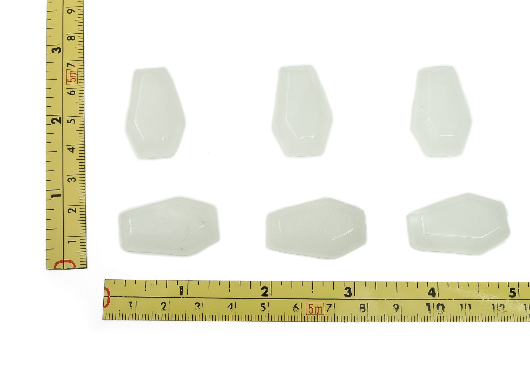 Clear quartz coffin-shaped cabochon crystal carving, 30mm gemstone from GemstoneGO with detailed polished surface.