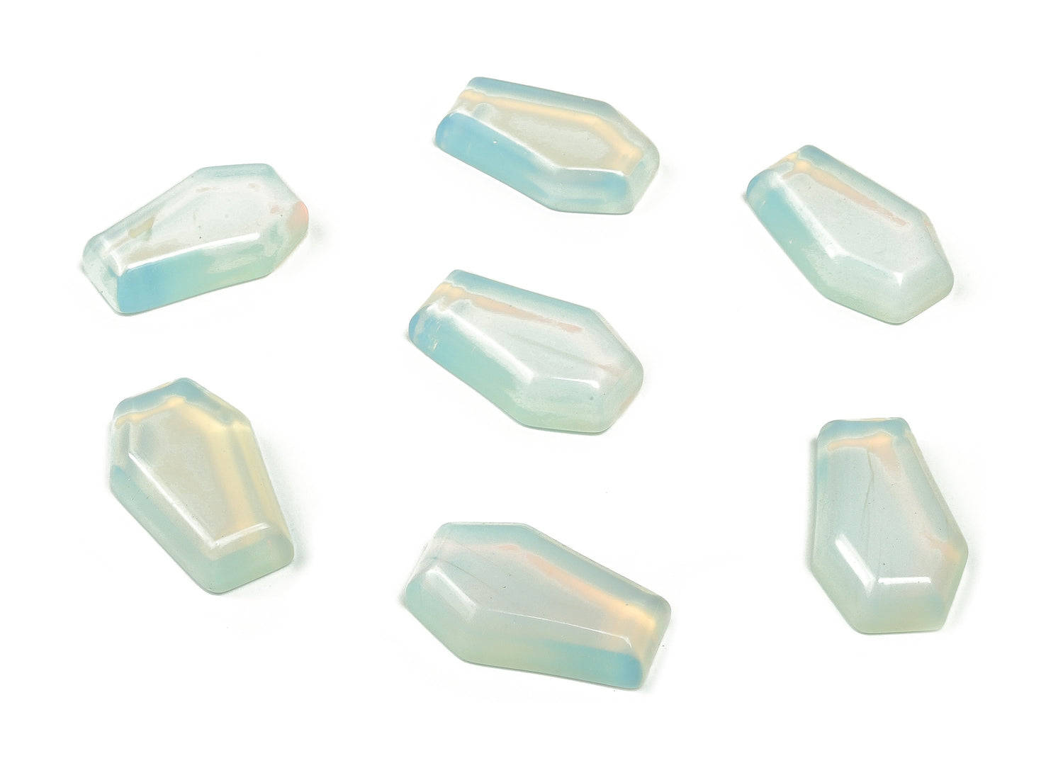 Opalite coffin-shaped crystal cabochon carved gemstone measuring 30mm, showcasing a smooth, polished surface with luminous blue and white hues.