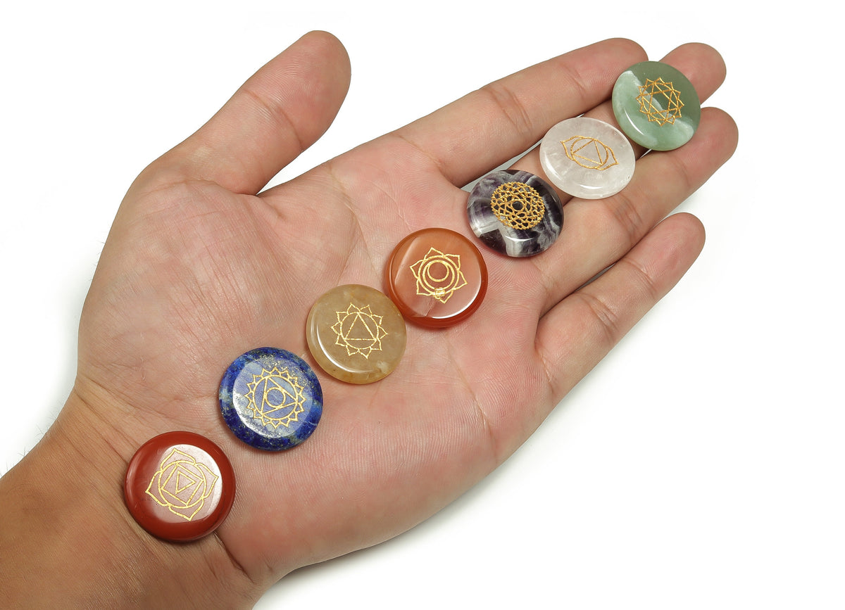 Natural 7 Chakra stones set with colorful crystals for meditation, featuring a gemstone ornament from GemstoneGO.