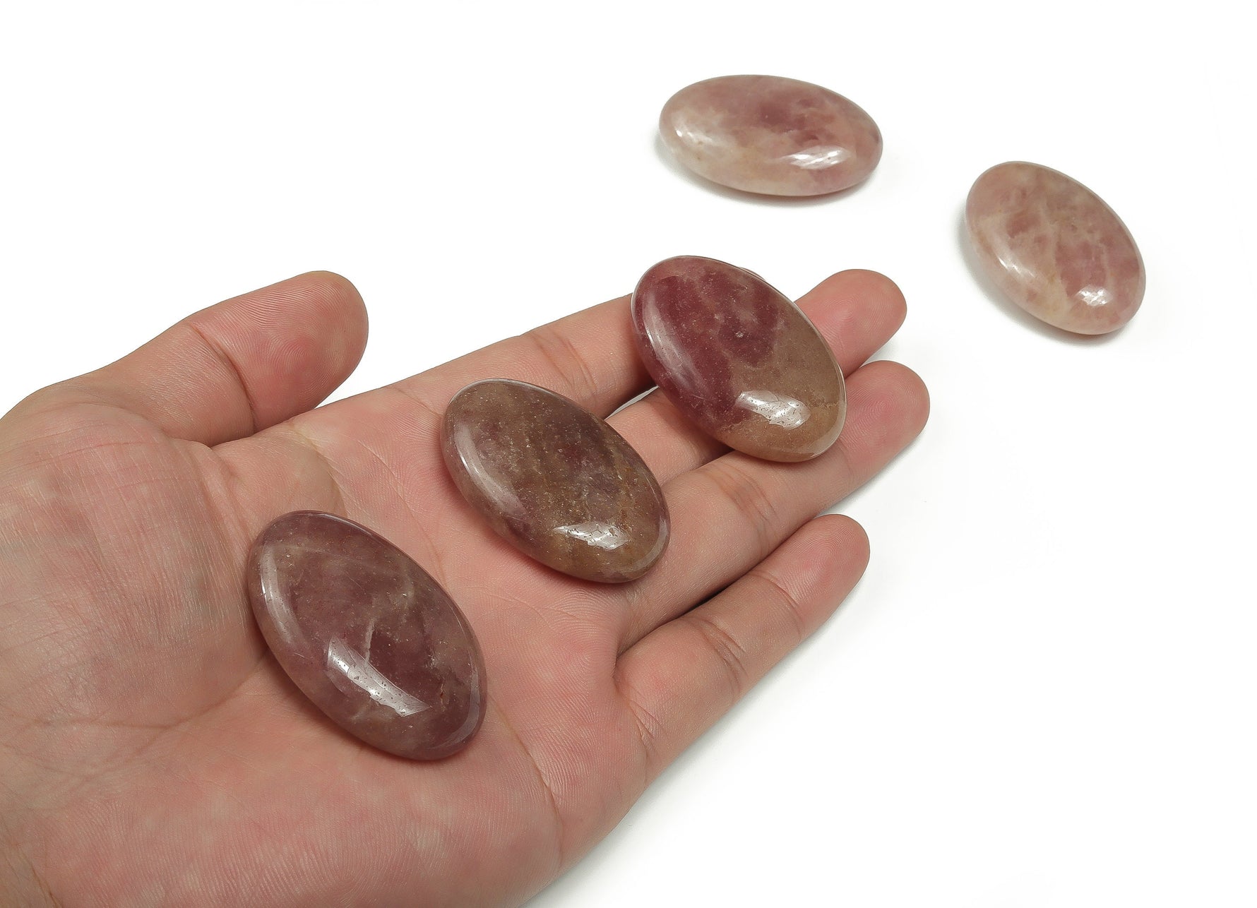 Strawberry Quartz palm gemstone spa stone, 45x35mm, with polished smooth surface and vibrant pink color, ideal for relaxation or healing.