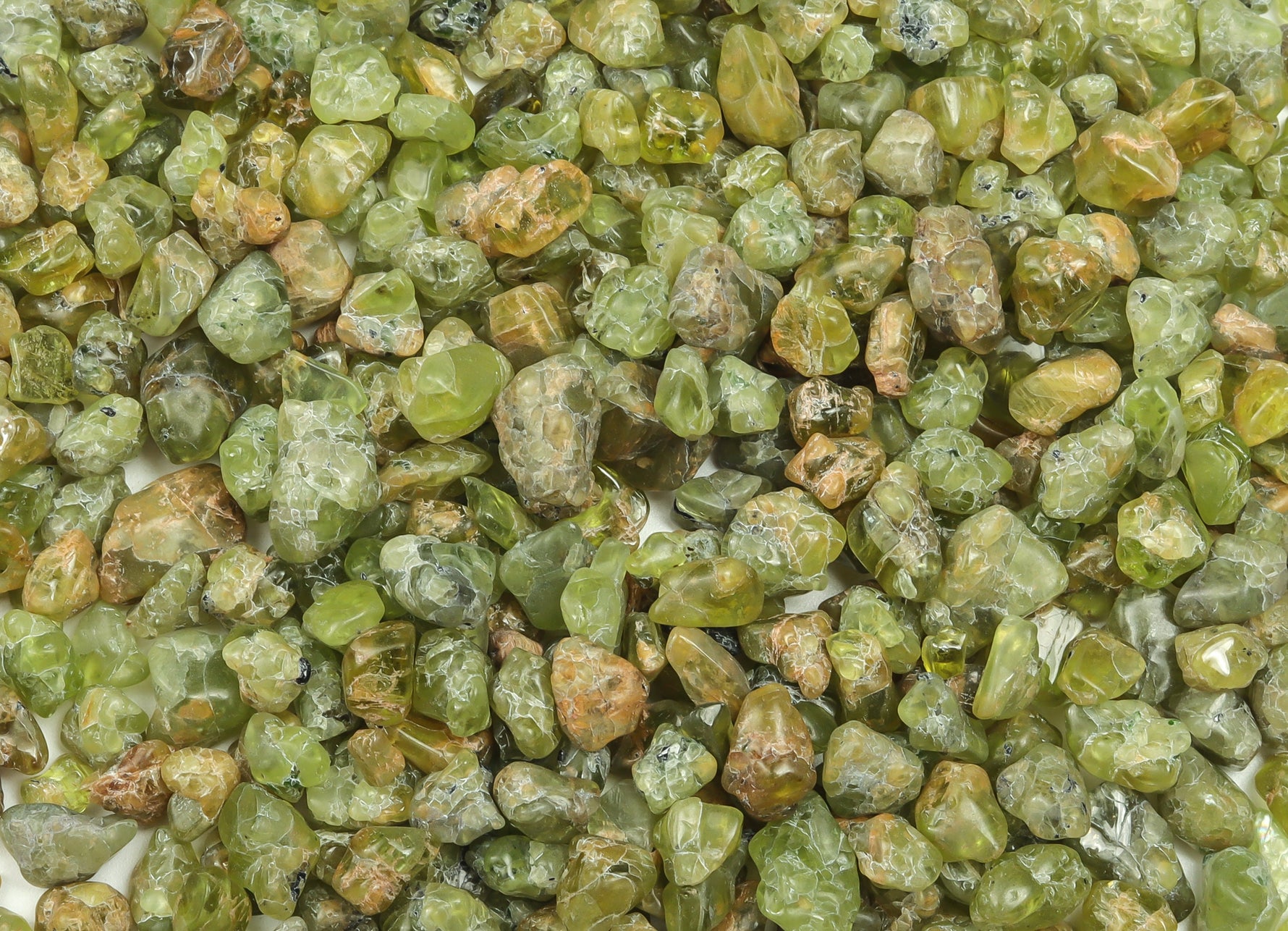 Semi-tumbled peridot crystal chips from GemstoneGO, olive green olivine stones, 5-10mm bulk gemstone for jewelry making.