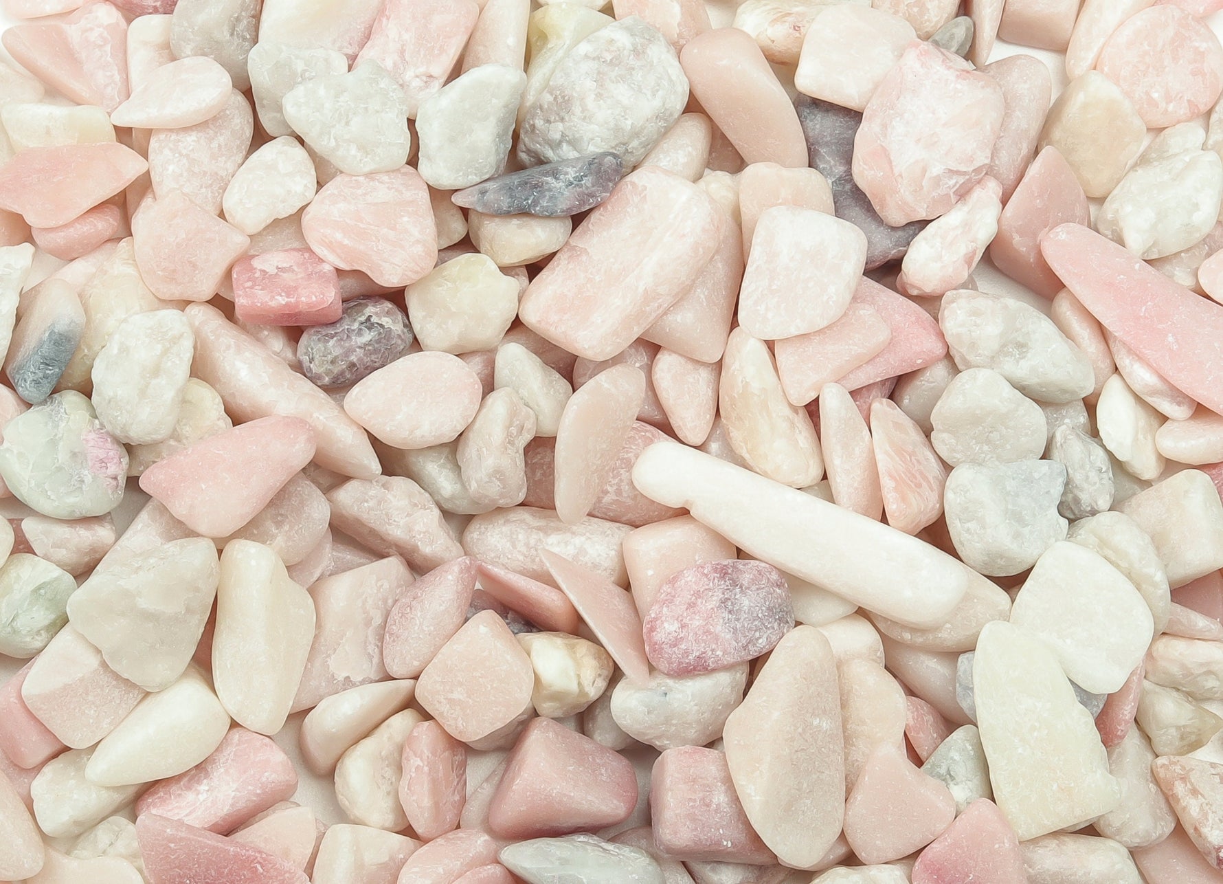 Pink Opal Crystal Chips from GemstoneGO, semi-tumbled 7-12mm stones, showcasing smooth, vibrant pink gemstone chips.