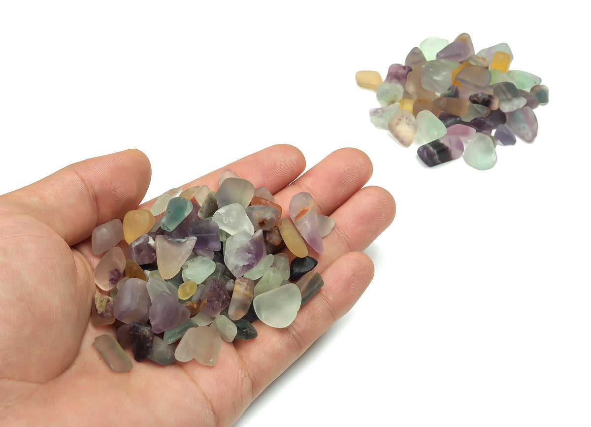 Semi tumbled fluorite crystal chips from GemstoneGO, 7-12mm bulk stones with vibrant green and purple hues, perfect for jewelry or crafts.