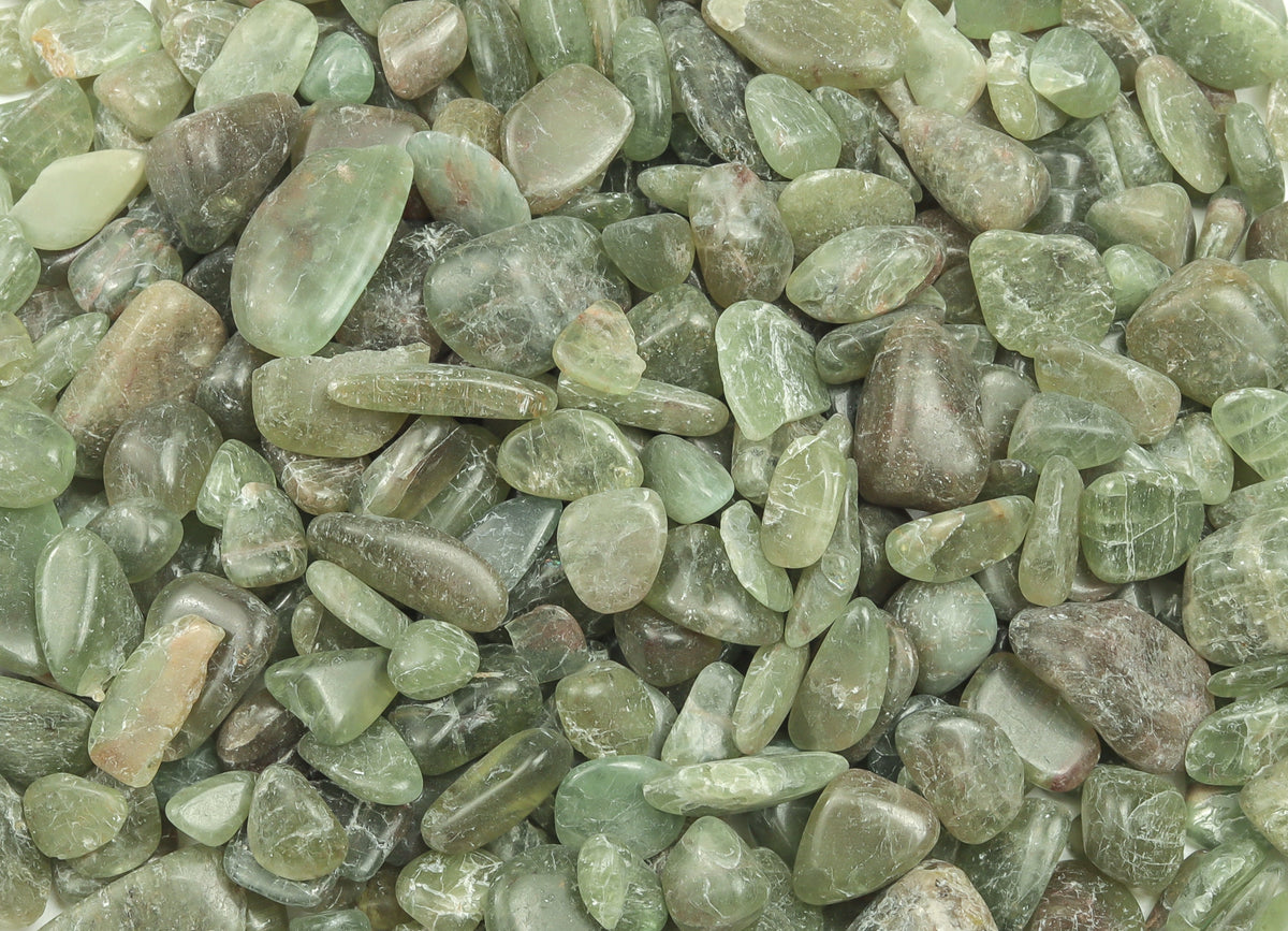 Green Apatite crystal chips, semi-tumbled gemstones in 7-12mm, from GemstoneGO, shown in a natural close-up view.