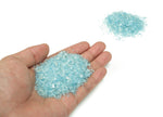 Aquamarine crystal chips in 2-6mm semi-tumbled stones from GemstoneGO, showcasing vibrant blue and green hues for jewelry making.