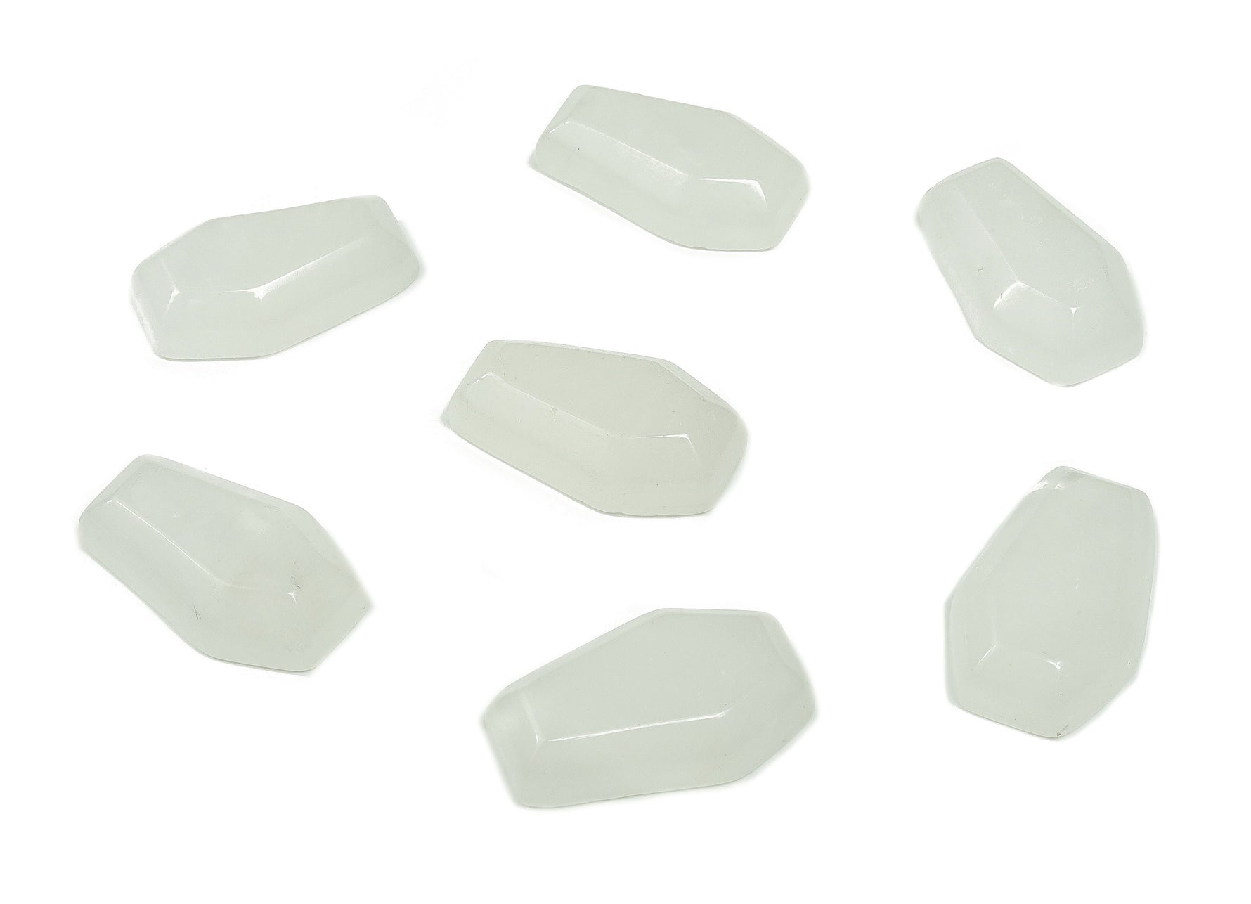 Clear quartz coffin-shaped cabochon gemstone with detailed carving, measuring 30mm, from GemstoneGO.