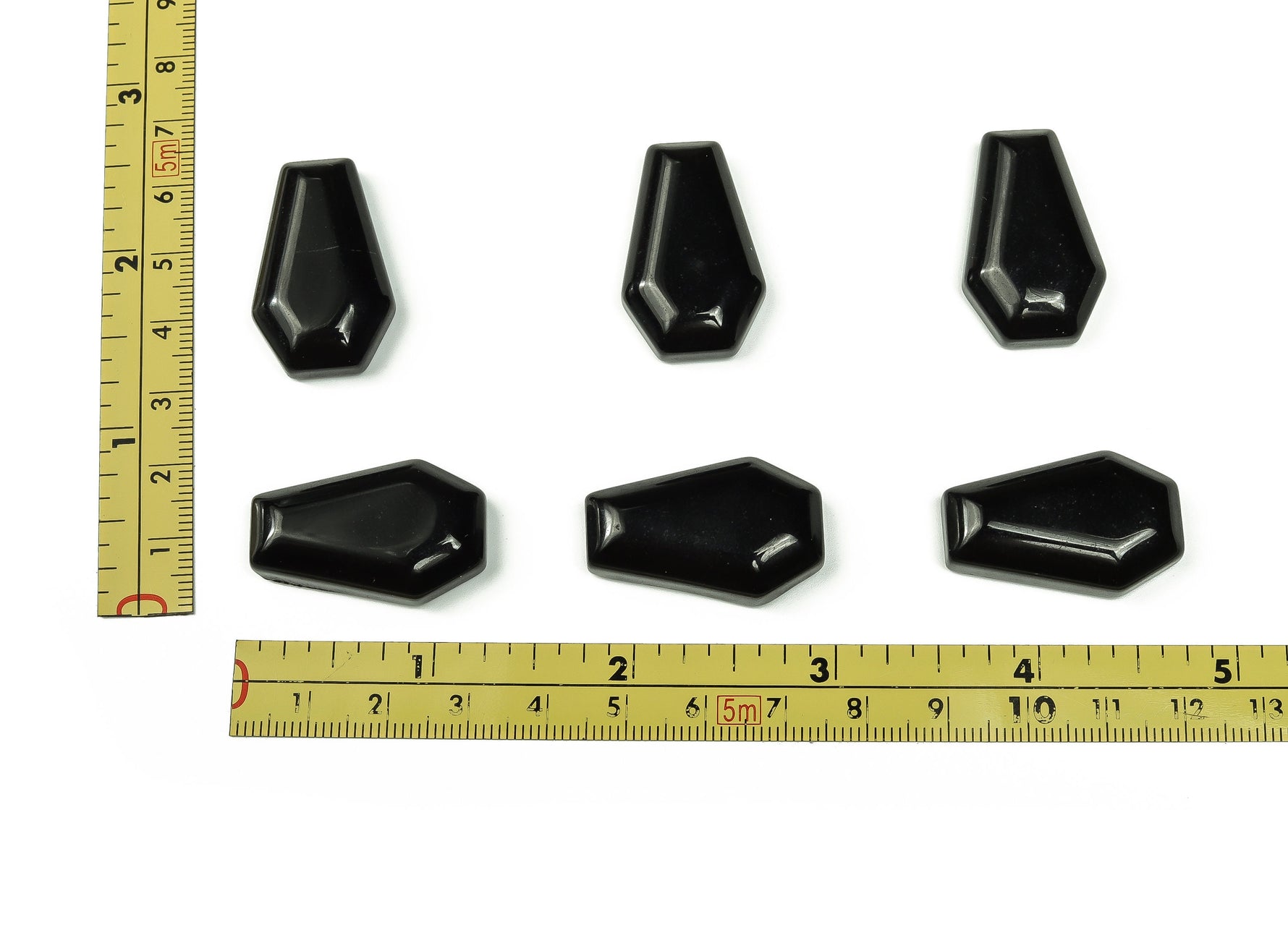 Obsidian coffin-shaped crystal cabochon carving from GemstoneGO, 30mm, showcasing smooth black stone with detailed carvings.