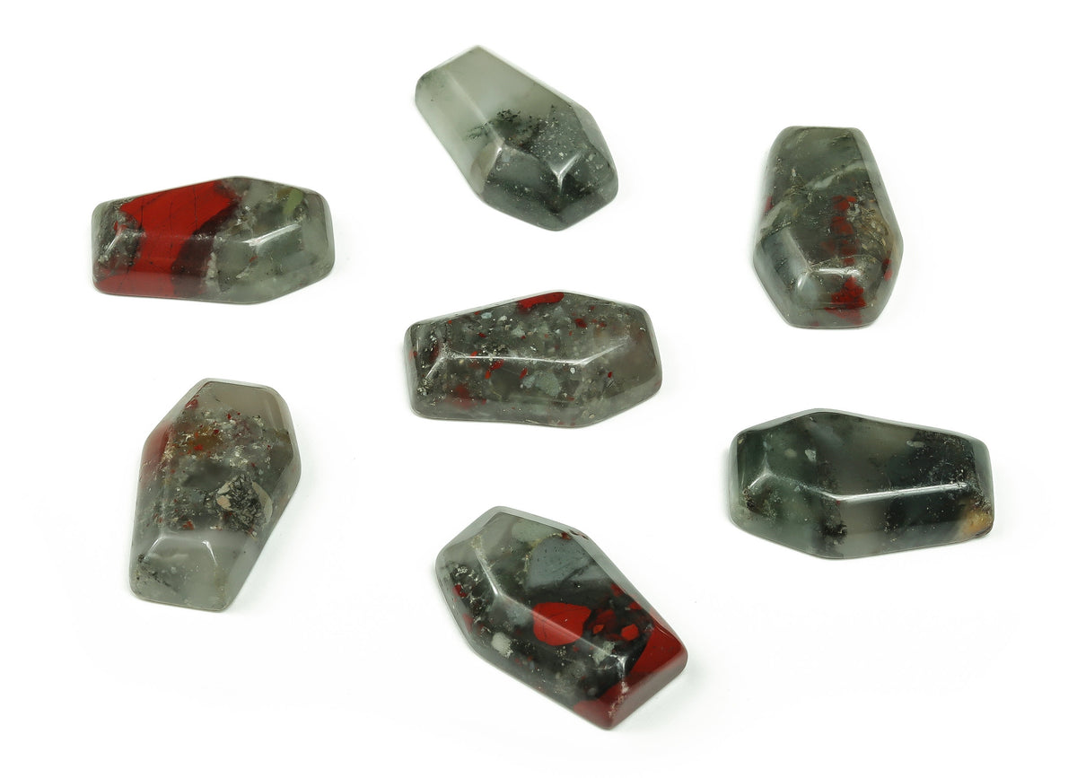 African Bloodstone coffin-shaped crystal cabochon with detailed carving, 30mm gemstone for healing and decorative purposes.