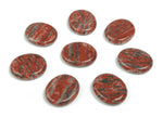Red sesame jasper flat gemstone slab showing natural red and beige patterns, smooth surface, and rectangular shape.