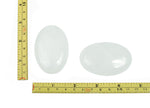 Clear Quartz palm gemstone spa stone, 60x40mm, smooth rectangular shape with natural crystal clarity from GemstoneGO.