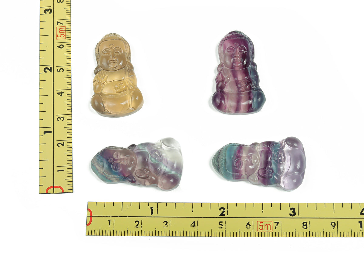 Fluorite Buddha carving gemstone from GemstoneGO, showing a detailed, colorful Buddha figure carved from smooth fluorite stone.