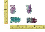 Fluorite rabbit gemstone carving from GemstoneGO, showcasing vibrant purple and green colors with detailed carving.