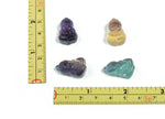 Fluorite Buddha carving gemstone from GemstoneGO, showcasing vibrant purple and green mineral hues and intricate Buddha figure details.