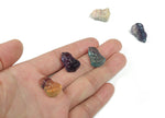 Fluorite Buddha carving gemstone from GemstoneGO showcasing a detailed, colorful Buddha figure carved from vibrant fluorite.