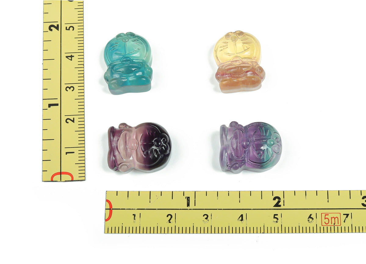 Fluorite cat carving gemstone from GemstoneGO, featuring vibrant purple and green hues in a detailed feline sculpture.