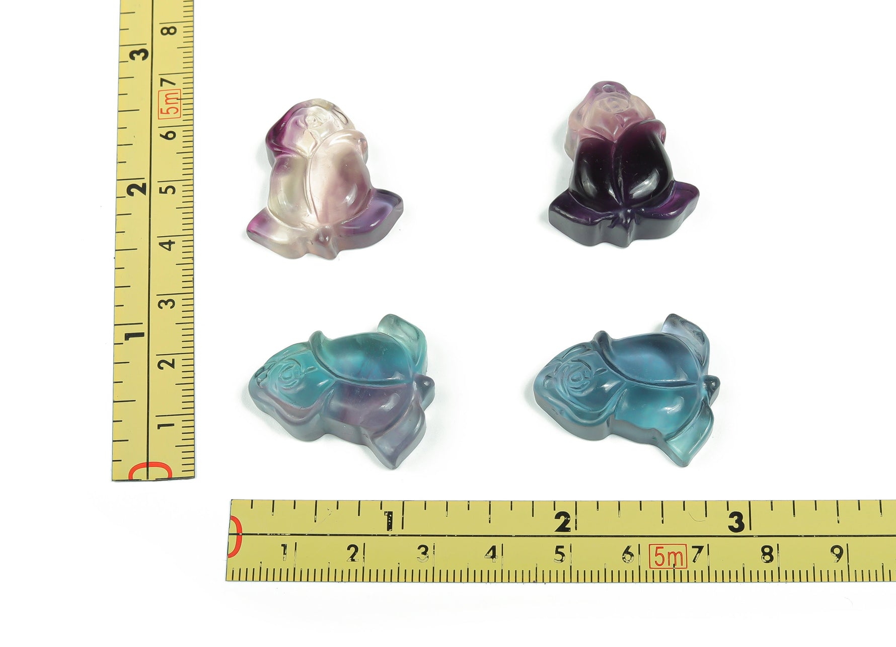 Fluorite rose flower carving gemstone from GemstoneGO featuring vibrant purple-green hues and intricate floral design.