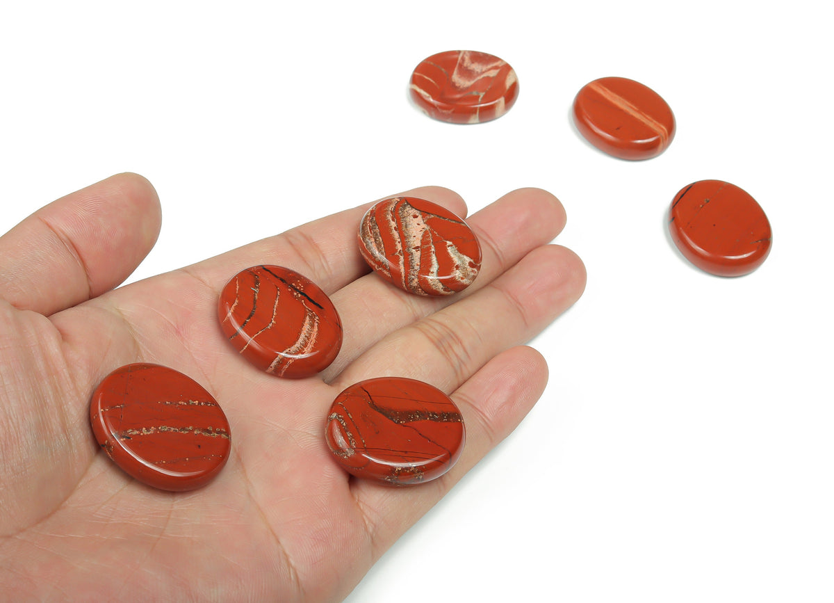 Red Jasper flat gemstone slab, 30x25x7mm, from GemstoneGO, showing a smooth, polished red jasper crystal with natural patterns.