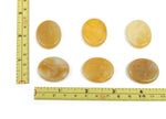 Yellow jade flat gemstone slab with 30x25x7mm dimensions, showcasing vibrant yellow color and smooth polished surface.