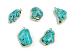 Turquoise crystal pendant with healing stones from GemstoneGO, showcasing a polished turquoise gemstone pendant on a silver chain.