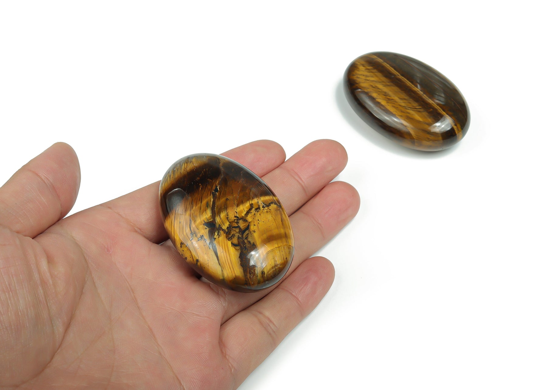 Tiger eye palm gemstone spa stone, 60x40mm, smooth polished natural gemstone for relaxation and massage use.