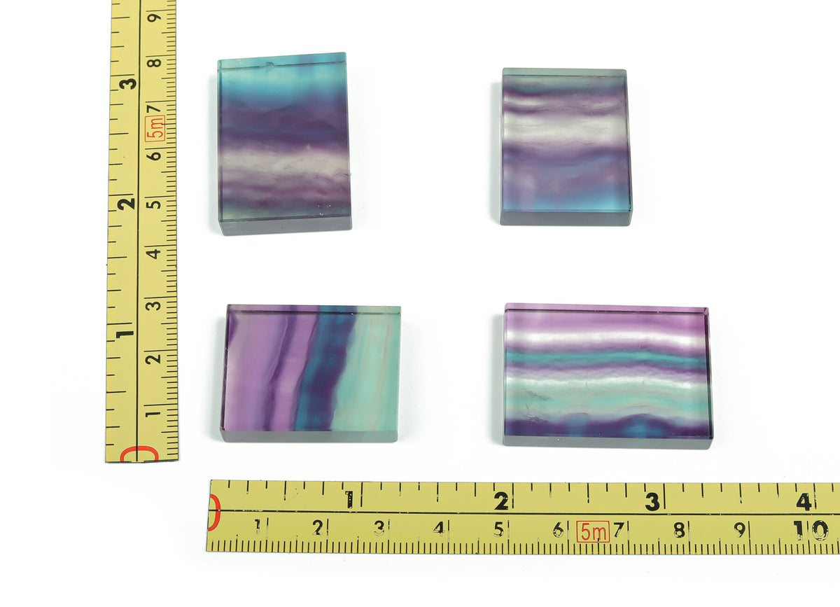 Bright green fluorite slice slab gemstone with natural banding and polished surface, showcasing vibrant colors and unique mineral patterns.