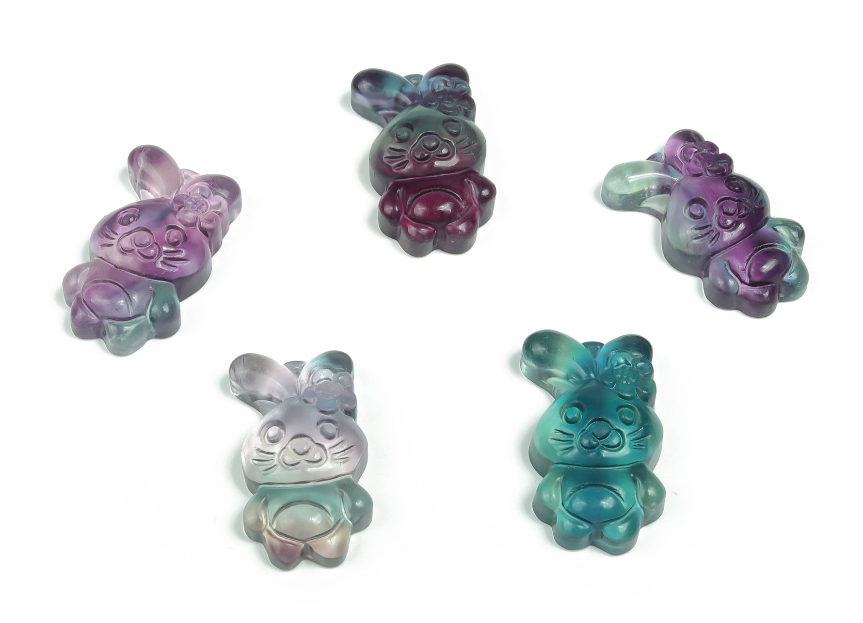 Fluorite rabbit carving gemstone from GemstoneGO, showcasing vibrant green and purple hues in a detailed rabbit shape.