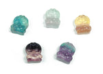 Fluorite cat carving gemstone from GemstoneGO, detailed purple and green mineral sculpture of a sitting cat.