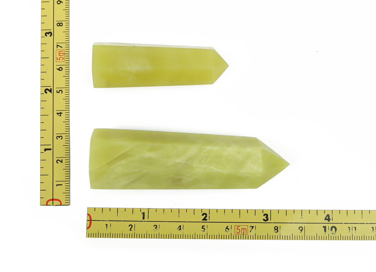 Lemon Jade Obelisk Tower crystal from GemstoneGO, showcasing a yellow-green gemstone with pointed obelisk shape and natural stone texture.