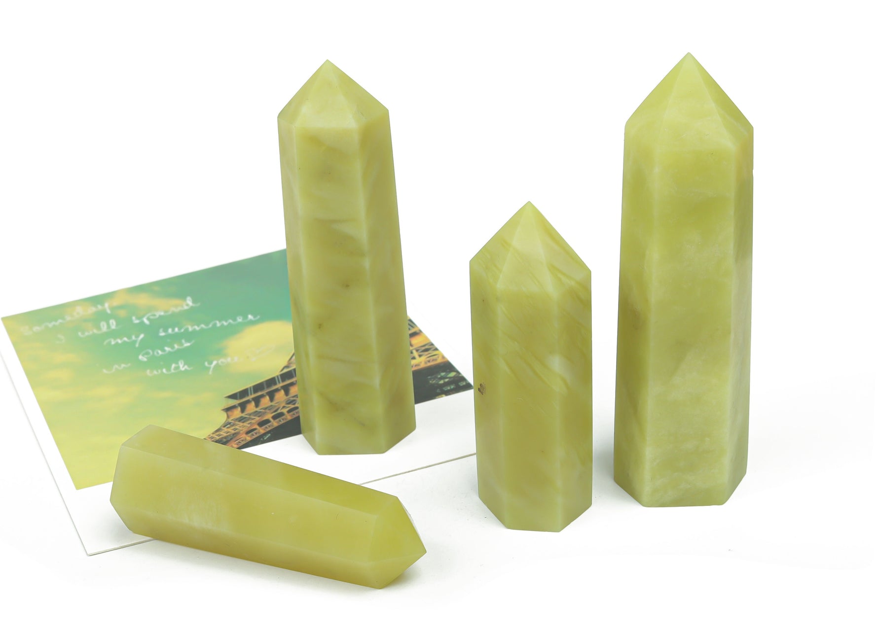 Lemon Jade Obelisk Tower crystal from GemstoneGO, showcasing a polished yellow-green gemstone with vertical shape and natural striations.