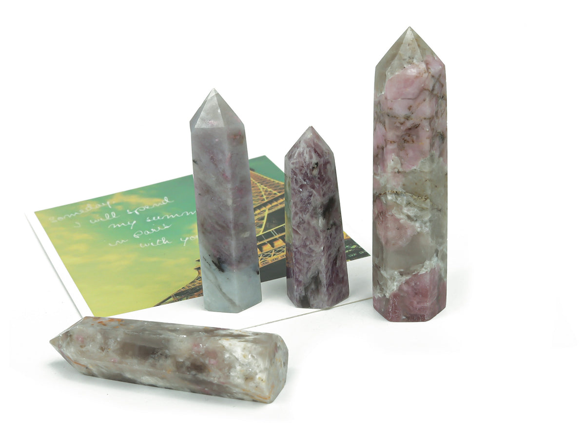 Plum blossom tourmaline obelisk tower crystal from GemstoneGO, showcasing pink and green hues with pointed tip and polished surface.