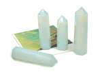 Opalite obelisk tower crystal by GemstoneGO, featuring a smooth, polished white and blue iridescent gemstone obelisk on a stand.