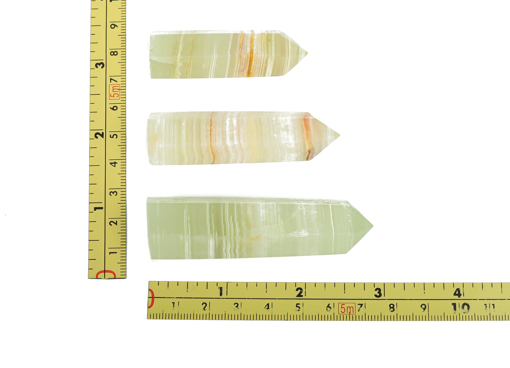 Afghanistan Jade Obelisk Tower Crystal from GemstoneGO, green polished gemstone with obelisk shape and detailed natural stone patterns.